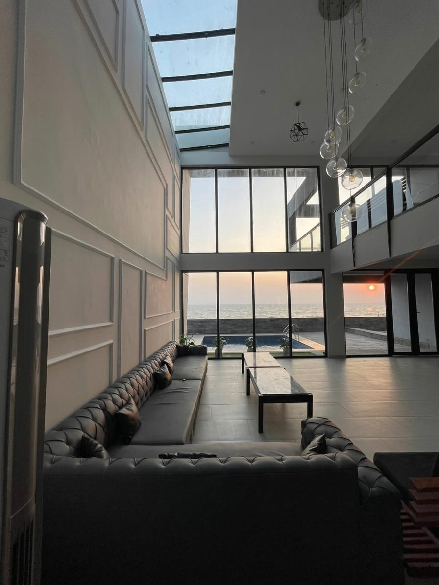 The Beach Hut Loft 59 lounge opening onto the sea and pool